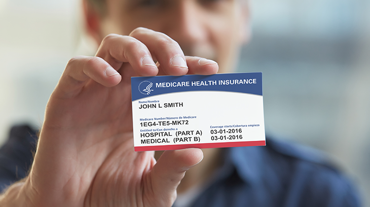 Man holding medicare card